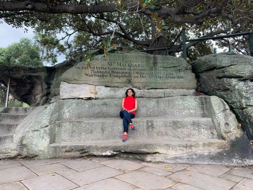 A girl sitting at Mrs Macquarie Chair in Sydney