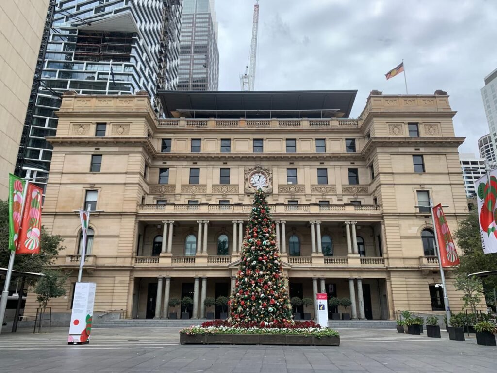 a picture of a Christmas tree in front of Customs House in Sydney