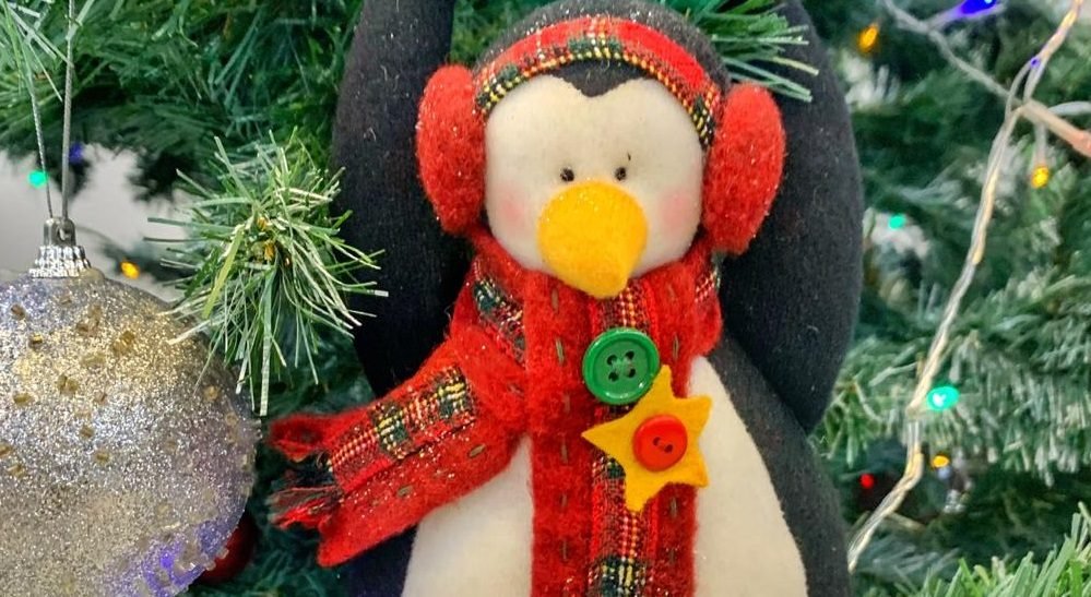 a doll with Christmas decoration